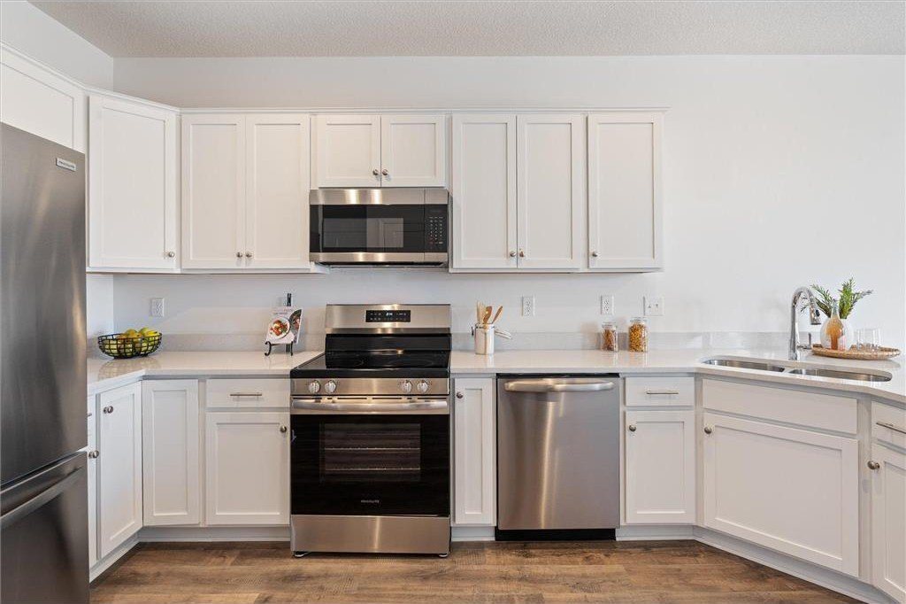 White kitchen with stainless appliances, 6708 Jorgensen Ave S