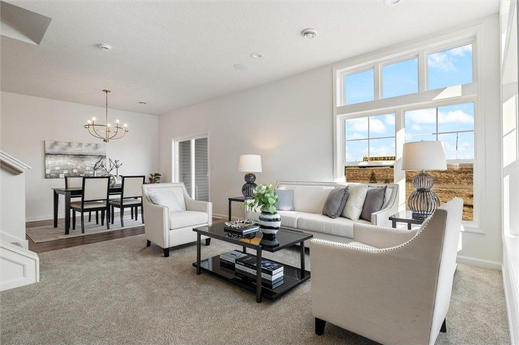 Bright living room with tall windows, 6700 Jorgensen Ave S