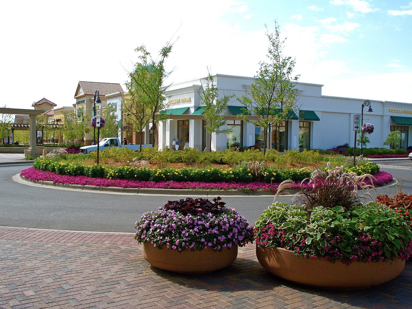 Flower planters and storefronts at The Shoppes at Arbor Lakes