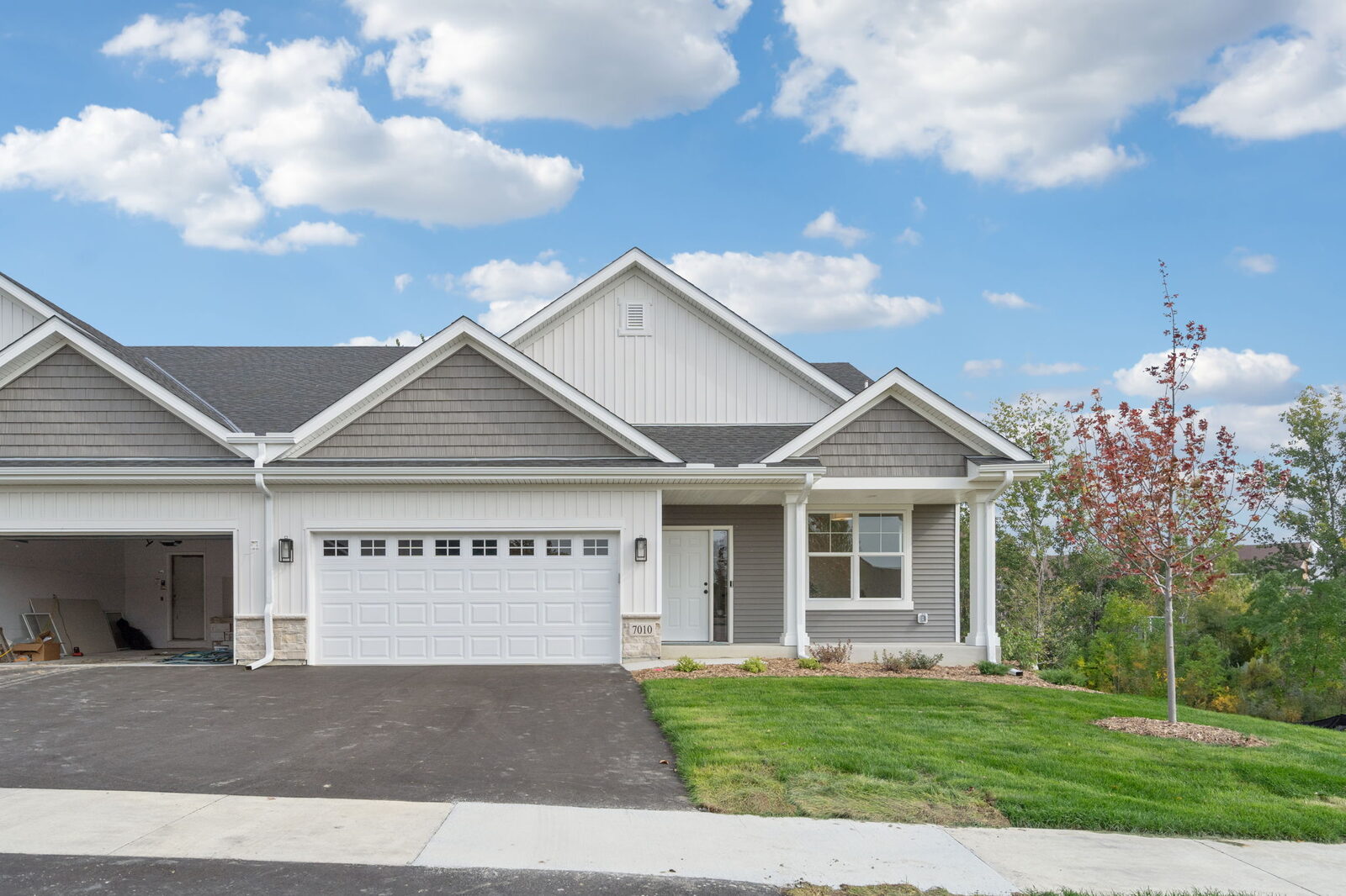 Sunny front view of Donnay Homes twin homes at Fox Briar Ridge East in Maple Grove