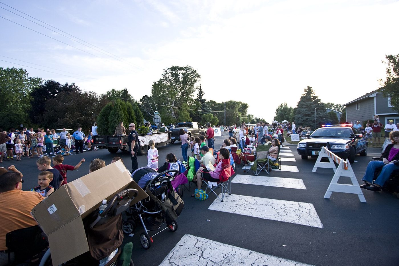 Families lining the street for the Maple Grove Days parade